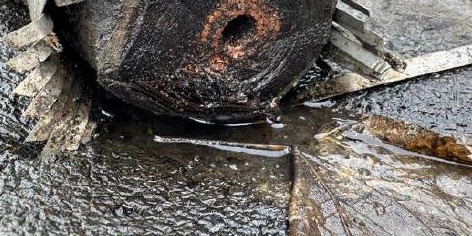 Dielectric oil seeping from a cut high-voltage cable end during on-site sampling