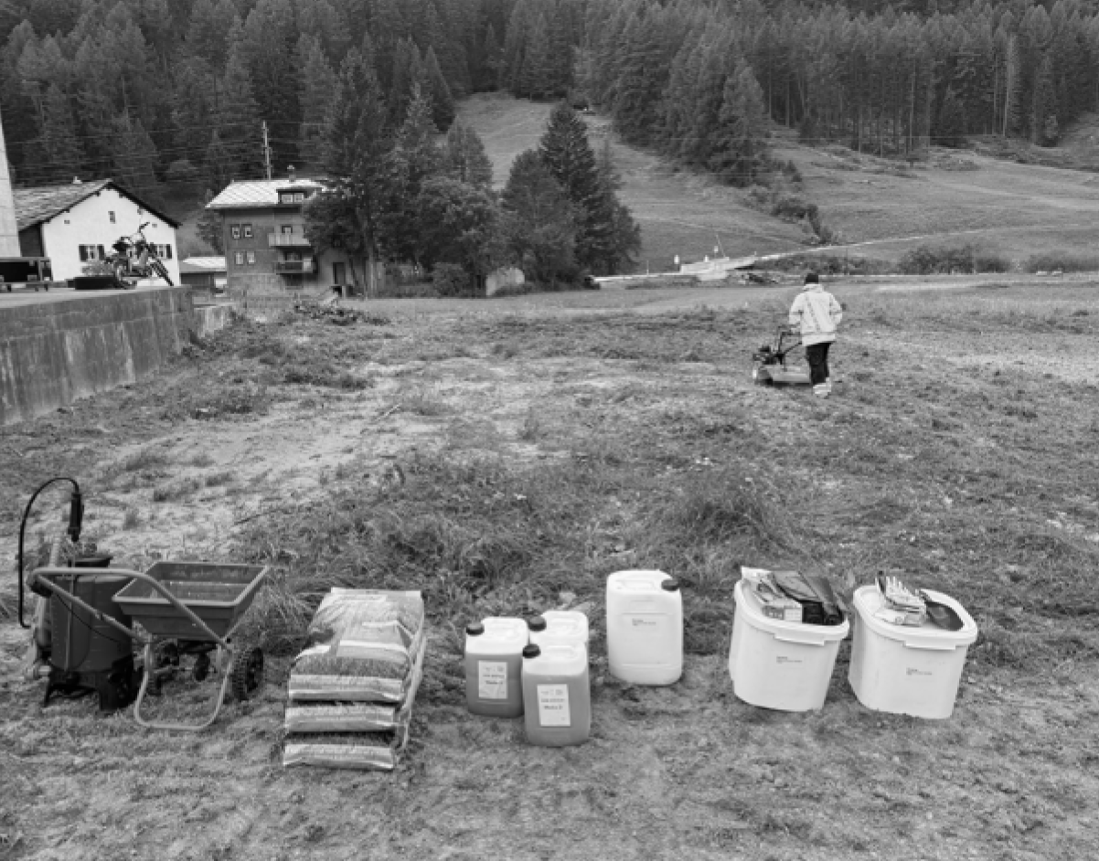 Bioremediation dosing equipment and bacterial solution containers laid out on an alpine plot at 1 550 m altitude