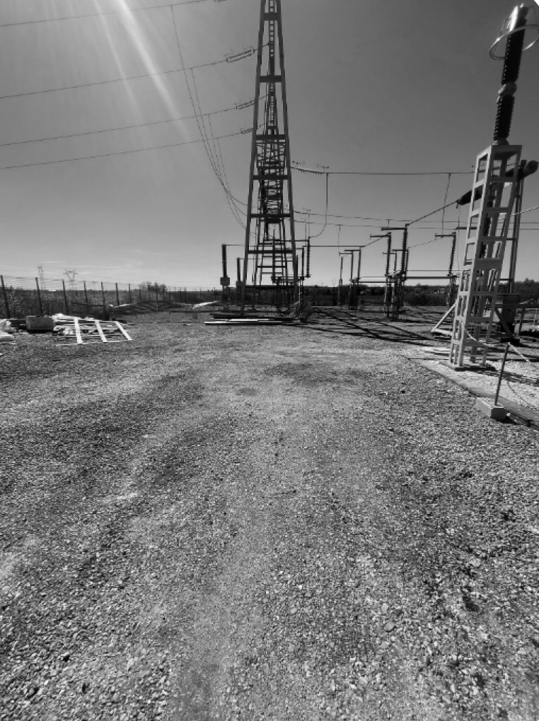 Gravel surface inside a high-voltage substation compound treated by surface bioremediation